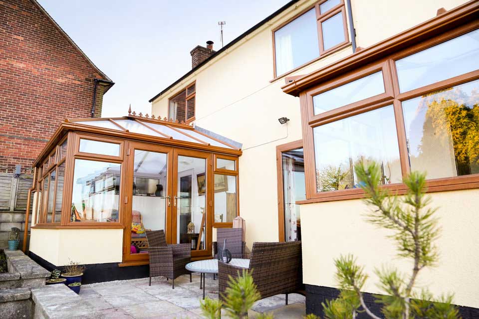 Woodgrain french doors on a conservatory