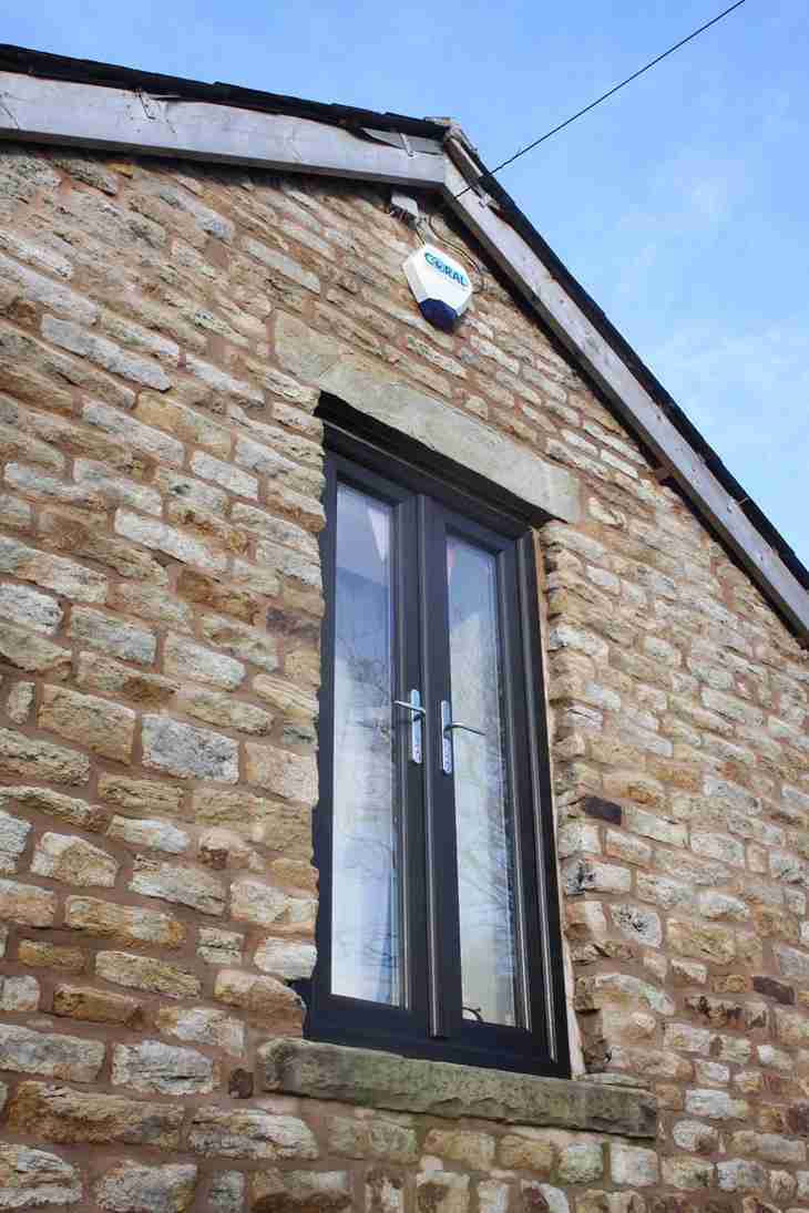 French doors above a house