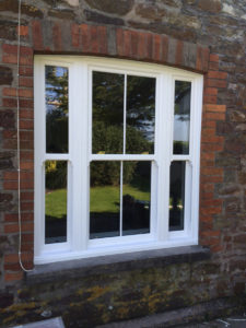 White Sliding Sash Windows on a red brick building Swindon