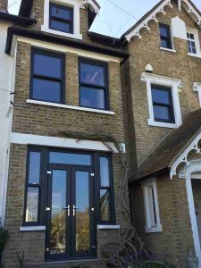 uPVC Sliding Sash Windows on a Traditional Brick Building Swindon