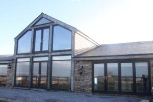 Black Modern House with uPVC doors and windows installed in Swindon