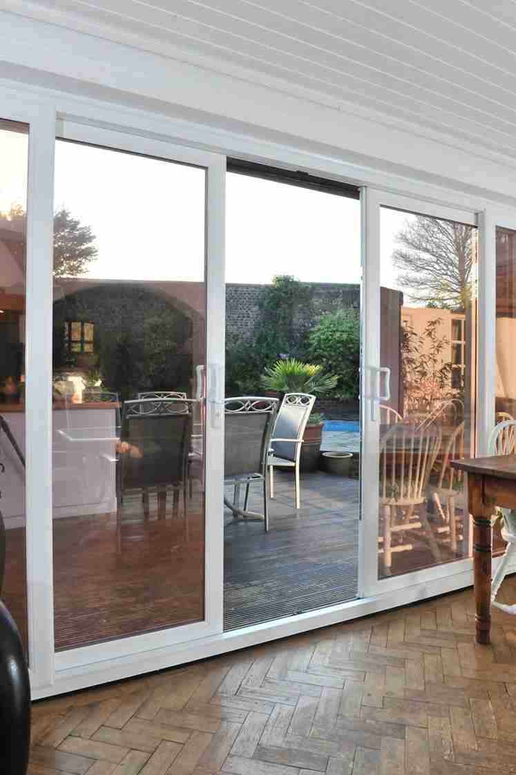 Open sliding doors leading to a patio