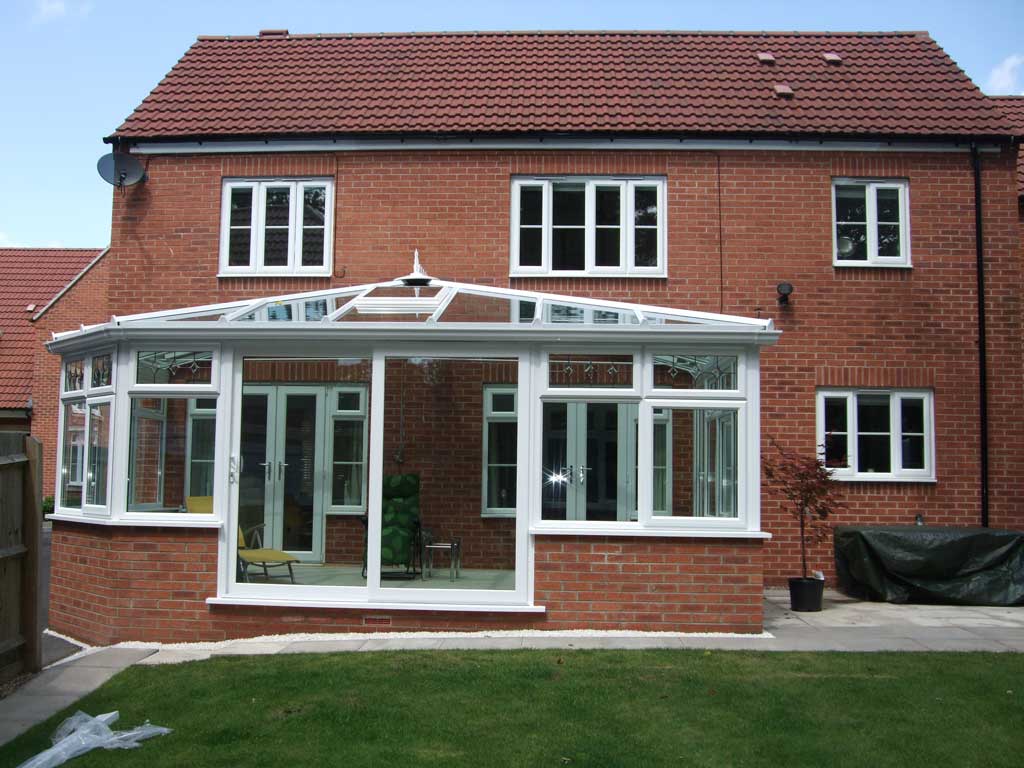 Patio doors before a brick orangery