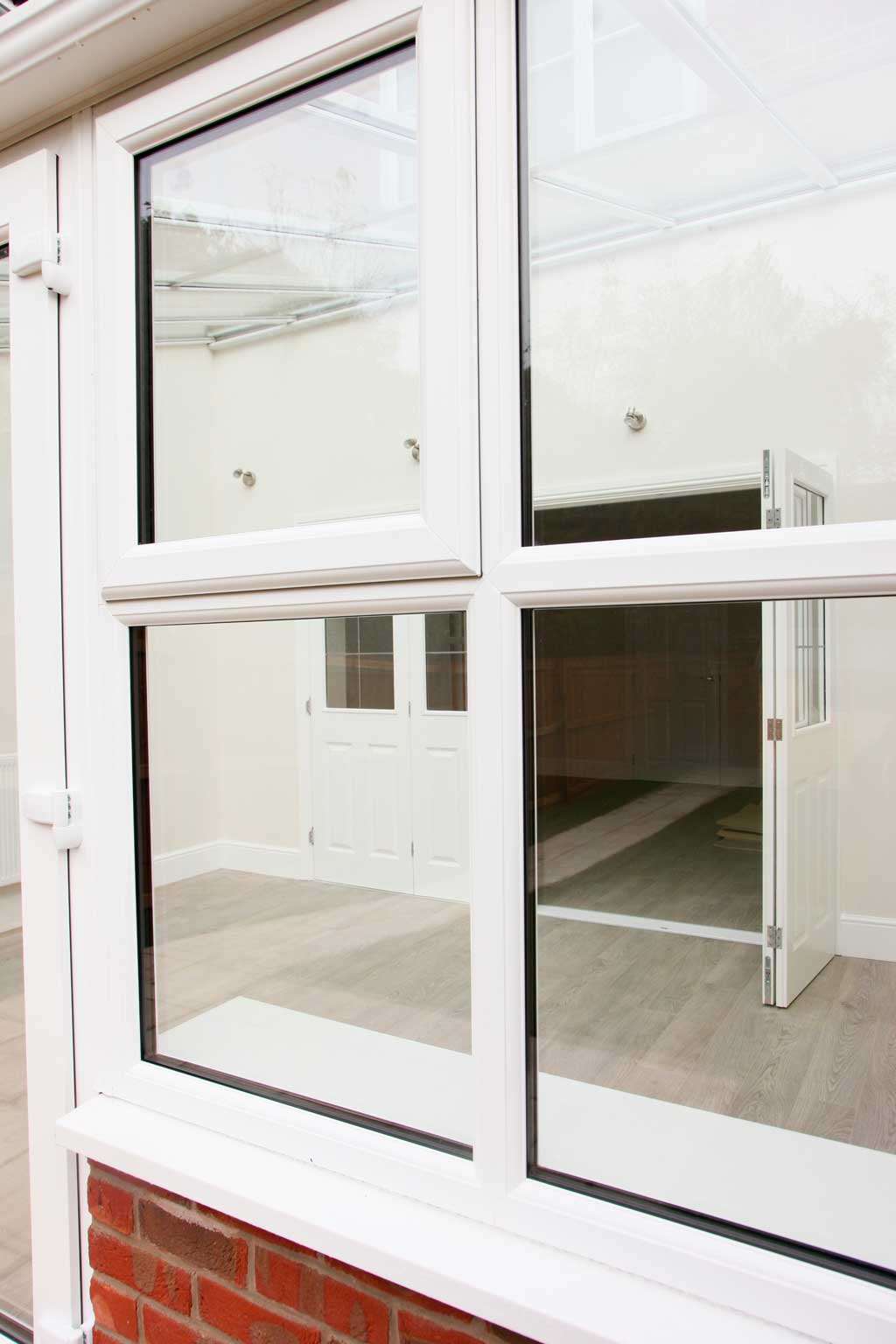 White uPVC Windows in a Red Brick Wall in Swindon