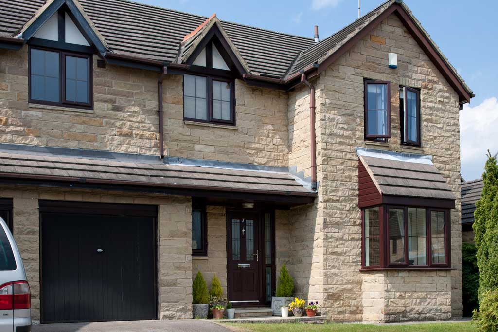 uPVC Sliding Sash Windows on a Brown Brick Home in Swindon