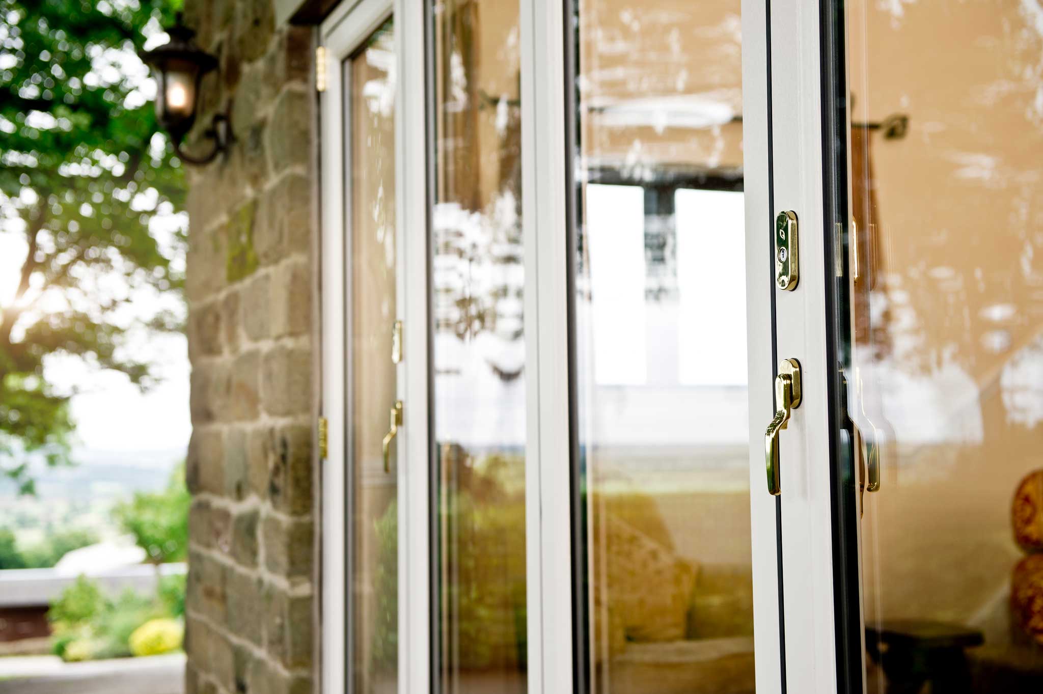 white aluminium bifolding doors on a brown brick building in newbury