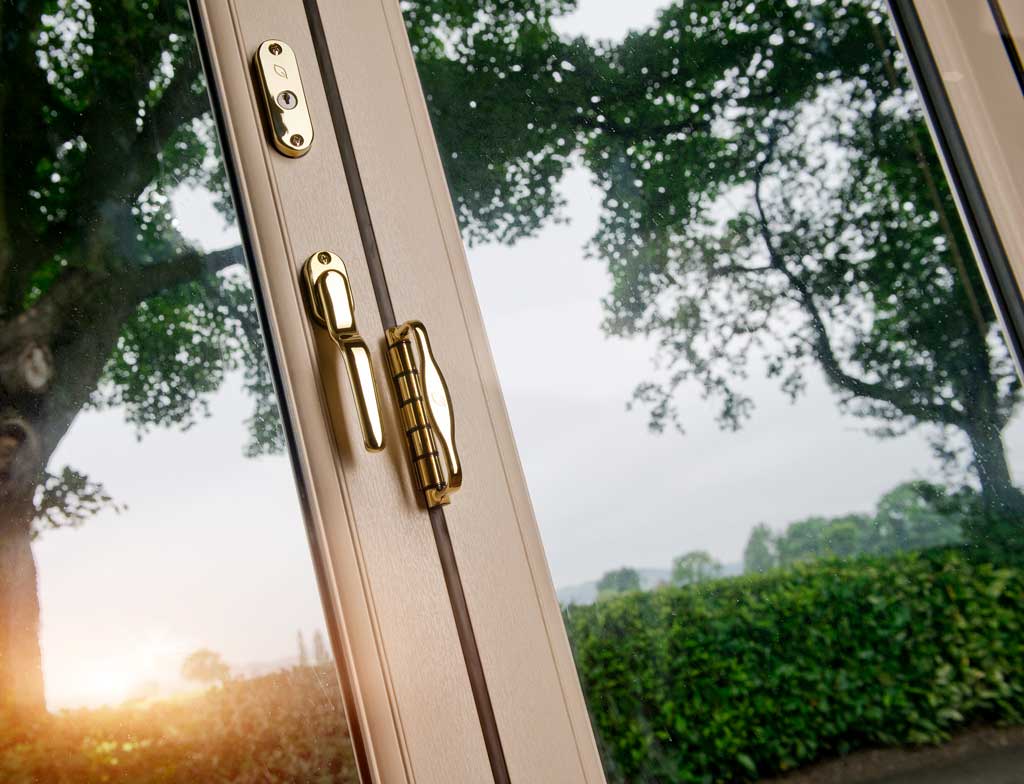 closed white aluminium bifold doors with gleaming hardware