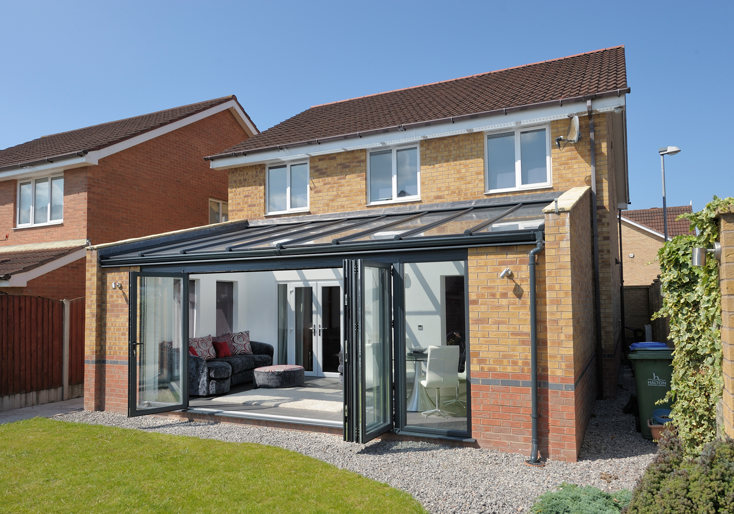 Aluminium bifold doors installed in a conservatory Swindon