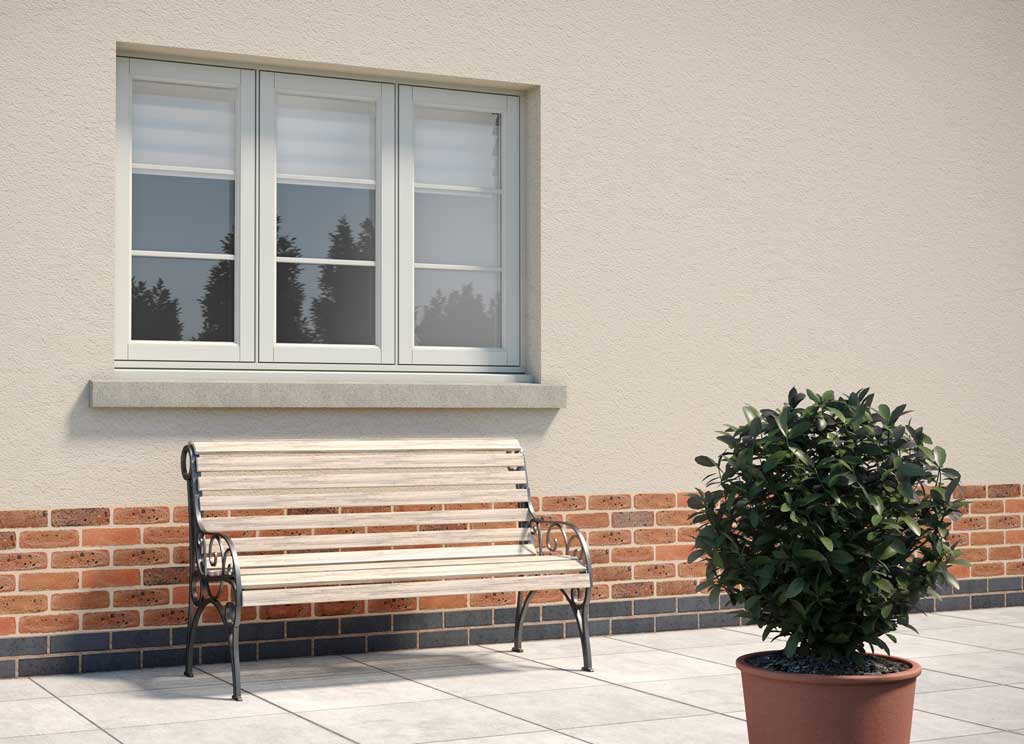 Triple glazed flush casement windows on a beige walls behind a bench